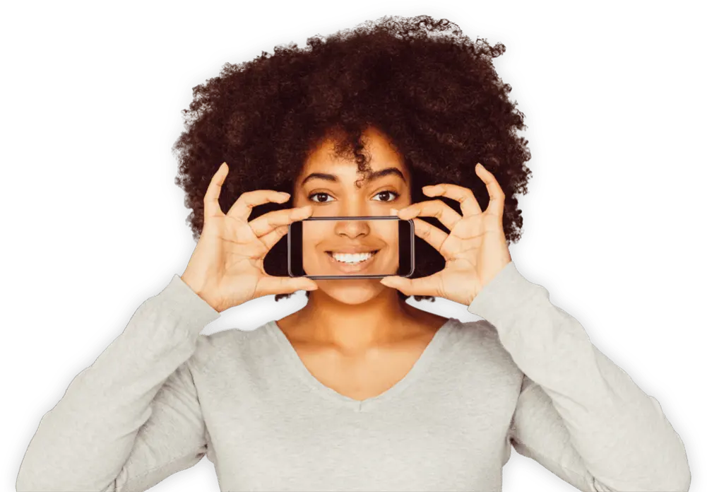 Person holding smartphone displaying smile